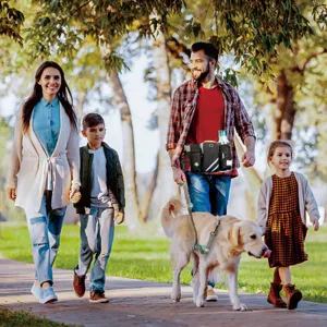 Multifunctional outdoor pet training waist bag with leash shown in park lifestyle setting