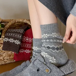 Cozy winter wool blend mid-tube socks with classic Fair Isle snowflake knit pattern design.