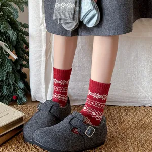 Winter warm women mid-calf wool socks with classic Nordic snowflake pattern casual apparel.