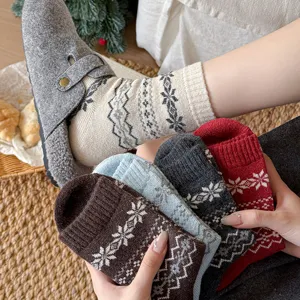Cozy wool winter socks featuring traditional Fair Isle snowflake patterns for warm daily wear.