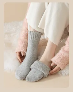 Thick winter wool socks for women, cozy solid color mid-tube thermal terry socks detail view.