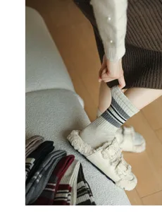 Cozy striped women's mid-tube wool socks for autumn and winter, preppy style knit daily wear.