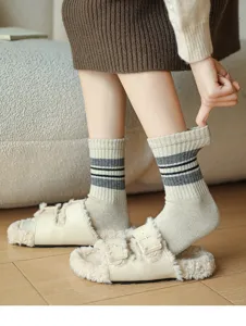 Cozy winter women's mid-tube striped wool socks with plush fuzzy slippers for daily casual wear.