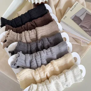 Cozy knitted leg warmers with button detail, stylish winter warm socks for women and girls.