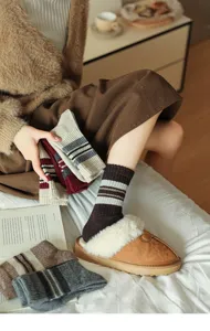 Cozy winter wool socks and plush slippers set for women, warm striped socks for daily wear.