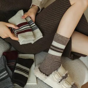 Cozy wool mid-calf socks for women, winter warm striped knitted fashion socks for daily wear.
