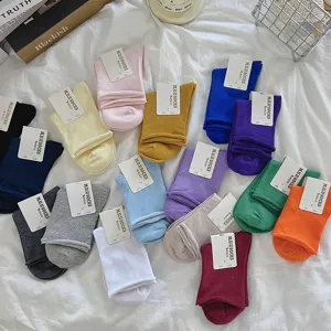 Solid color rolled cuff casual socks, soft breathable cotton daily wear, multiple colors available.