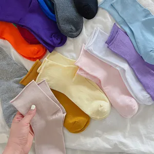 Women solid color casual socks with rolled edge design, soft and comfortable daily wear.