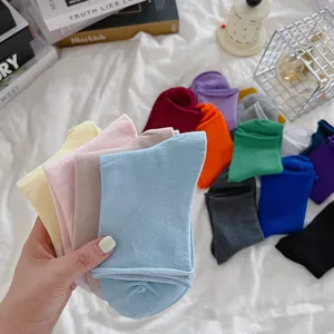 Detailed view of colorful rolled-top women socks, soft fabric and comfortable wear in scene.