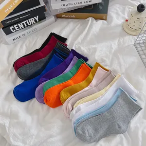 Colorful solid cotton socks detail shot showcasing various vibrant shades and soft texture.