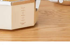 Close-up of cream cosmetic organizer with elegant English text print and chrome trim.