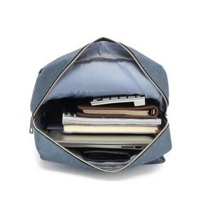 Detailed view of spacious blue canvas laptop backpack interior with organized items