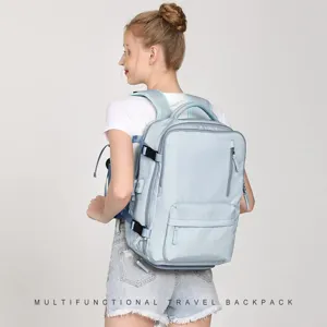 Caucasian female model wearing a large light blue multifunctional travel backpack detail