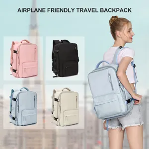 Large capacity travel backpack for women in multiple colors shown on a model outdoors