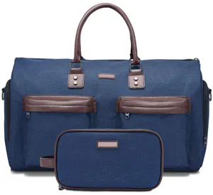Detailed view of a blue canvas travel duffel bag set with brown leather accents and pockets