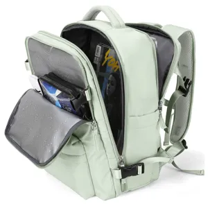 Interior detail of mint green travel backpack with wet-dry pocket and multi-compartments