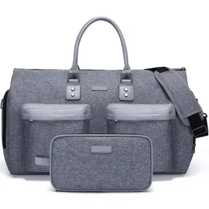 Close-up of grey multifunctional travel duffel bag and matching accessory pouch set