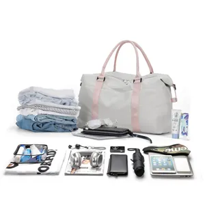 Detailed view of the large grey duffle bag's spacious interior capacity with travel gear