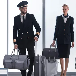Versatile gray garment bag and large capacity travel duffel used in airport terminal