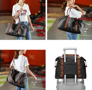 Black travel duffel bag featuring brown straps and a back sleeve for luggage handles
