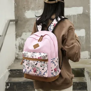 Sac à dos rose fleuri en toile décontracté avec des détails marron pour l'école et le quotidien.