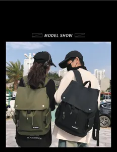 Urban lifestyle view of couple wearing large capacity waterproof backpacks in green and black
