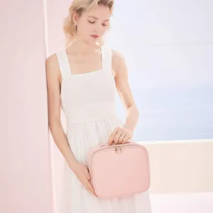 Elegante neceser de maquillaje de PU rosa portátil con textura cruzada para viajes