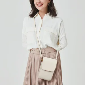 Elegant cream PU leather mobile phone crossbody bag worn by a model in a stylish outfit