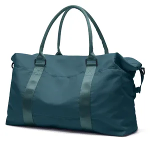 Full view of a spacious teal travel duffel bag with handles and nylon texture.