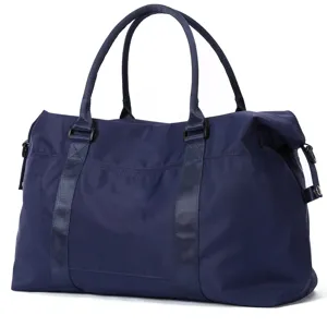 Side detailed view of a navy blue nylon travel duffel bag for gym and weekend trips