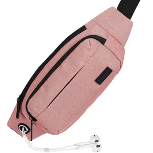 Close-up of a pink sport waist bag with white wired earphones plugged into its media port