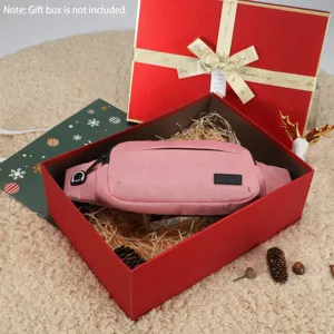 Detailed view of the pink sports waist bag in a festive gift box setting