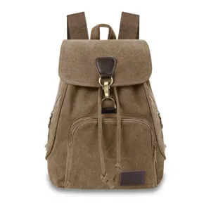 Front view of a vintage khaki canvas backpack with drawstring and metal clasp