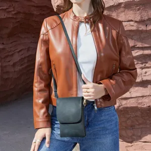 Stylish women's PU leather mobile phone crossbody bag displayed on model in outdoor scene