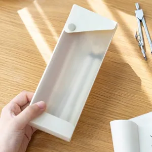 Minimalist transparent plastic pencil box with snap button closure for students