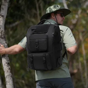 Detailed view of a black multi-functional fishing backpack worn in an outdoor setting