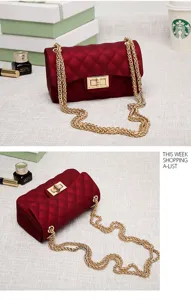 Detailed view of wine red matte jelly bag with quilted texture and gold chain