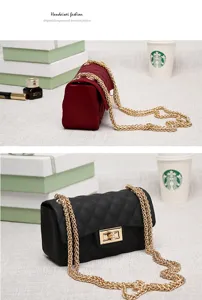 Detailed view of matte jelly quilted crossbody bags in red and black with gold chains