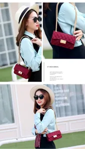 Detail view of woman carrying wine red matte quilted jelly bag with gold chain strap
