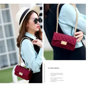 Elegant matte frosted burgundy jelly bag featuring quilted design and gold chain strap.