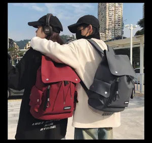 Back view of models wearing water-repellent large-capacity backpacks in red and grey colors