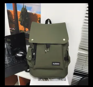 Close-up of olive green waterproof backpack with flap and side pockets