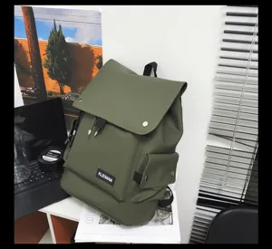 Detailed view of olive green waterproof backpack with large flap and front logo patch