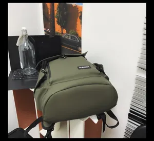 Waterproof army green backpack featuring a large capacity flap top design in an office context