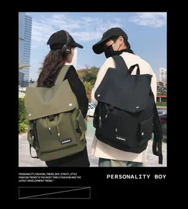 Outdoor view of waterproof large capacity backpacks in green and black colors