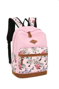 Détail de sac à dos d'étudiant en toile florale rose, sac décontracté avec poche avant.