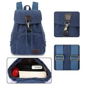 Vintage blue canvas backpack for women featuring metal buckles and large interior compartment