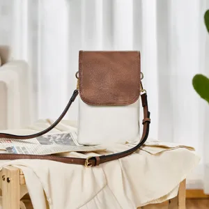 Detailed view of bicolor PU leather phone bag with brown flap and white body.