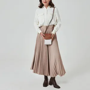 Elegant small two-tone PU leather crossbody phone bag shown on model in a studio setting