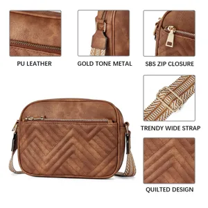 Detail view of brown quilted PU leather crossbody bag with trendy wide strap and gold hardware.
